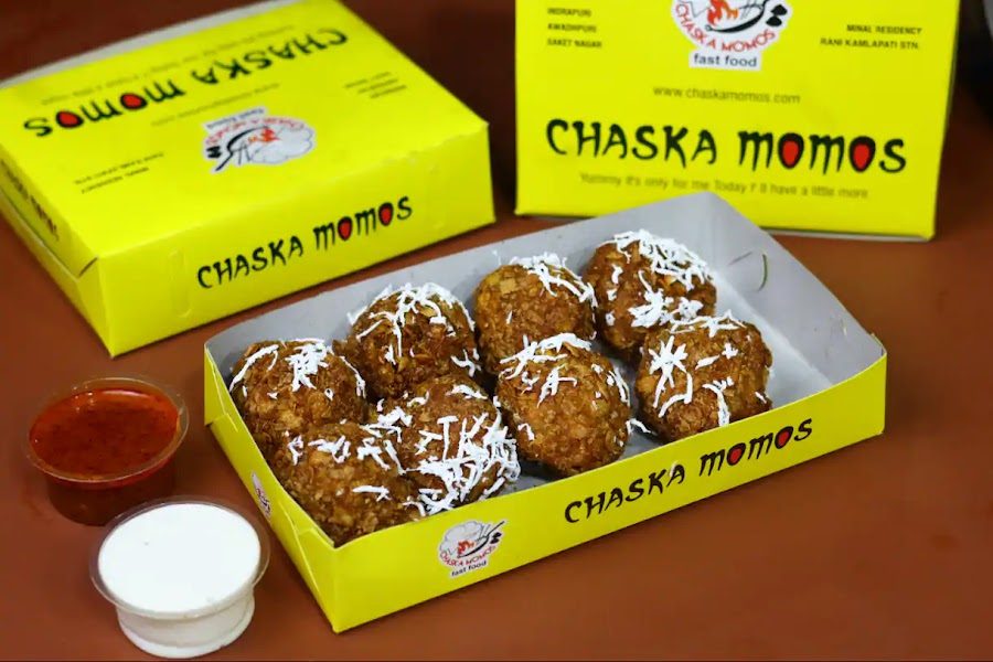 Kurkure momos in a yellow box